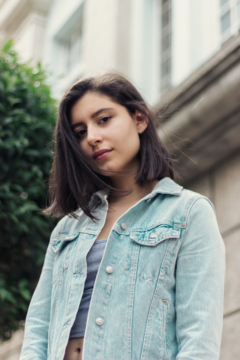 woman in blue denim button up jacket